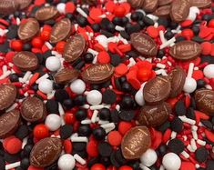 red, white and black sprinkles are scattered on top of each other