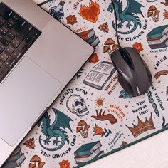 a laptop computer sitting on top of a mouse pad