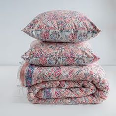 three pillows stacked on top of each other