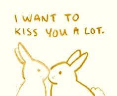 a drawing of two rabbits with the words i want to kiss you a lot