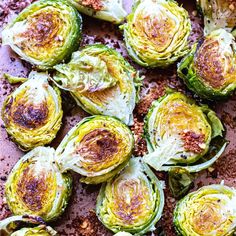 brussel sprouts with garlic and parmesan cheese on a baking sheet