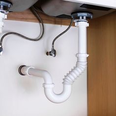 the pipes are connected to the sink and faucet