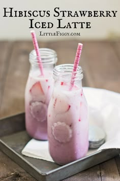 two glasses filled with ice cream sitting on top of a tray