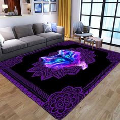 a living room area with a couch and purple rug