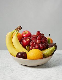 a bowl filled with lots of different types of fruit