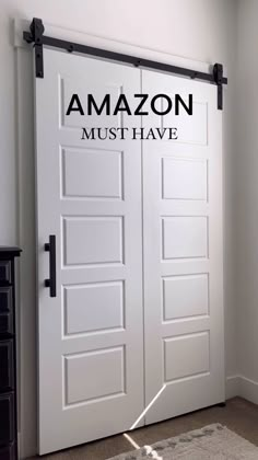 a white door with the words amazon must have written on it in black and white