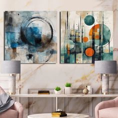 two paintings are hanging on the wall above a coffee table in a modern living room