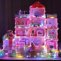 the doll house is lit up and has lights on it's sides as well