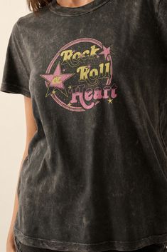 Mineral washed graphic t-shirt. Vintage-style "Rock & Roll Heart" text print with star graphics. Round neckline. Short sleeves. Relaxed fit. 100% Cotton. Imported. Designed in LA. Model wears size S. Heart Text, Star Motif, Love Graphic, Style Rock, Text Print, Rock Roll, Rock And Roll, Round Neckline, Graphic Tee