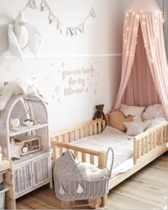 a baby's room with a crib, bed and dresser