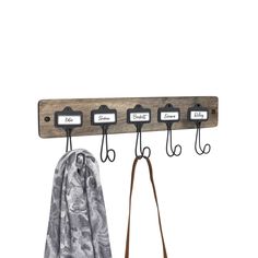 a coat rack with three coats hanging from it