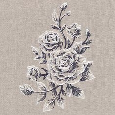 a bouquet of flowers is embroidered onto a piece of linen