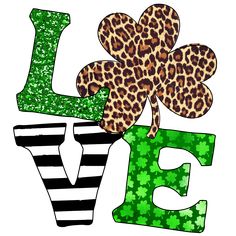 the letter e is decorated with an animal print and shamrocks on it's side