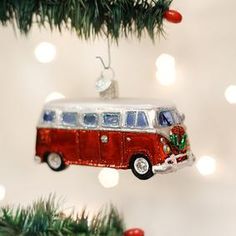 an ornament shaped like a bus hanging from a christmas tree