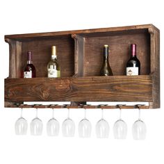 wine glasses and bottles are lined up on a wooden shelf that holds four wine glasses