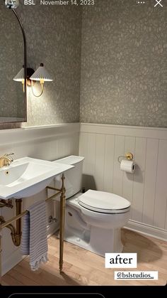 a white toilet sitting next to a sink under a mirror in a bathroom with wooden floors