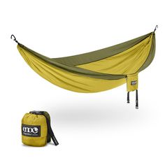 a yellow and green hammock sitting next to a bag