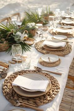 the table is set with plates and place settings for an outdoor dinner or brunch