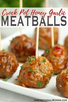 some meatballs are on a white plate with toothpicks in them and the words crock pot honey garlic meatballs