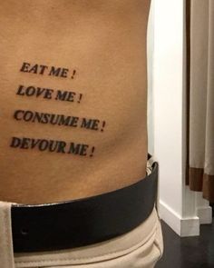 a woman's stomach with the words eat me love me consume me devour me written on it