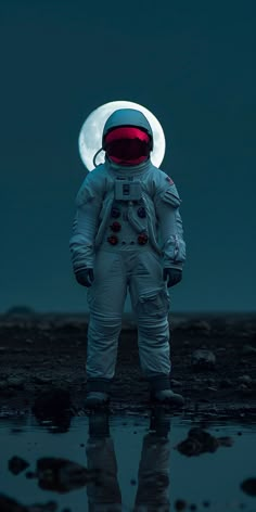 an astronaut standing in front of the moon with his hands on his hips and looking at the ground