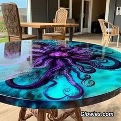 an octopus is painted on top of a glass table