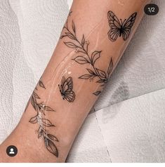 a woman's arm with butterflies on it