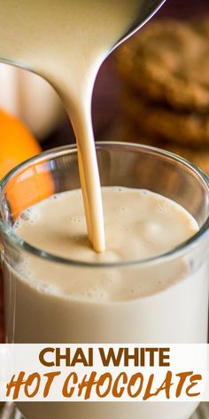 a person pouring milk into a glass with cookies in the background and text overlay reading chai white hot chocolate