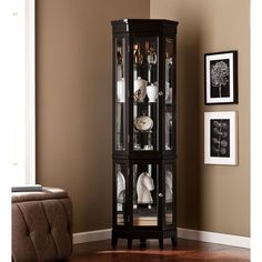 a tall black corner cabinet with glass doors