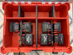 a red toolbox filled with different types of drill and screwdriver bits in it