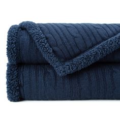 a blue blanket folded on top of each other