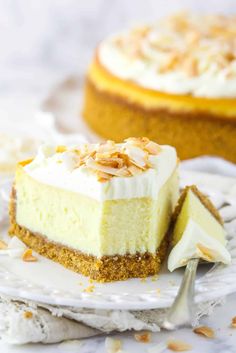 a slice of cheesecake on a white plate with a fork and another pie in the background