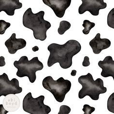 a black and white cow print with spots on it's back ground is shown