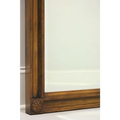 a large mirror sitting on top of a white floor