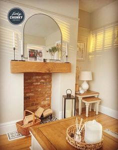 This living room has a golden glow due to the low evening sun which looks stunning. The space has a farmhouse inspired theme, but light coloured furniture and a solid oak mantel beam which frames the brick fireplace perfectly. Oak Mantel, Oak Fireplace, Wooden Mantel, Wood Mantel, Fireplace Beam, Evening Sun, Lounge Ideas, Wood Mantels, Farmhouse Living Room