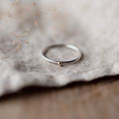 Gold and Silver Ring, Stacking Ring, 9ct Gold, Recycled Sterling Silver, Dot Ring How lovely is this silver stacking ring with a tiny ball of 9ct gold on top? This ring looks so pretty and dainty when it's worn on its own, but it also looks good mixed in with other stacking rings too for a chunkier look that you can create yourself!  Size The ring is made from recycled sterling silver. The band is 1.2mm thick with a tiny ball of (ct Gold on top.   Made especially for you Each ring is handmade by me from recycled sterling silver in my little studio on the edge of Northamptonshire. You can rest assured that each piece is 100% unique and made especially for you. Packaging Your ring will arrive beautifully packaged in one of my branded jewellery pouches, making them perfect for giving as prese Wood Polymer Clay, Gold And Silver Ring, Art Clay Silver, Diy Jewelry Making Tutorials, Ring Photography, Clay Silver, Silver Smithing, Rough Jewelry, Meaningful Love Quotes