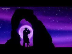 the silhouette of two people standing in front of an arch under a purple sky with stars