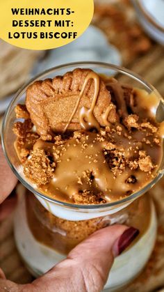 a dessert in a glass with caramel drizzle on top and the words weinhachts desselt mit lotus biscoff