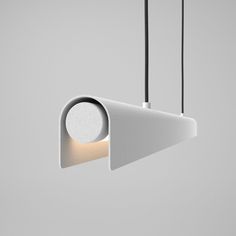 a white light hanging from the ceiling with two lights on each side and an object in the middle