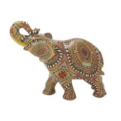 an elephant figurine with intricate designs on it's body and trunk, standing in front of a white background