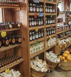 a store filled with lots of different types of food and drinks on shelves next to each other