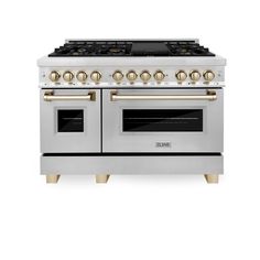 a white and gold stove with two ovens