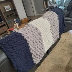 a couch with a blanket on top of it