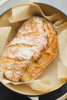 a loaf of bread sitting inside of a pan