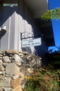 a street sign on the side of a building