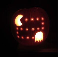 a carved pumpkin with an arrow cut out of it