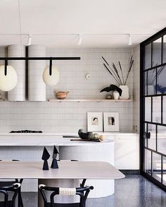 an instagramted photo of a dining room and kitchen