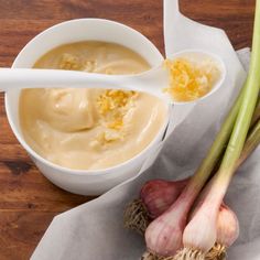 an onion and garlic soup in a white bowl