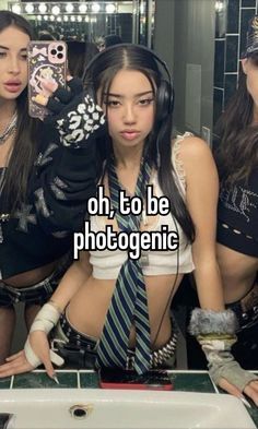 three beautiful young women standing next to each other in front of a mirror with the caption oh, to be photogenic