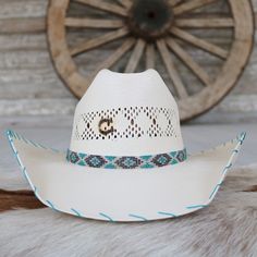 The Charlie 1 Horse Apache Jr. Children's Straw Cowgirl Hat is a delightful fusion of playful colors, charming patterns, and classic cowboy style. This vibrant hat features a multicolored patterned beaded hatband, a 4 1/8" cattleman crown for a stylish silhouette, and a 4" brim adorned with turquoise whip-stitched edges for a touch of elegance. Designed for young cowgirls who embody the spirit of adventure and joy.Fits up to 55.5 cm Western Blue Hat Bands For Festival, White Southwestern Hat For Rodeo, Blue Country Hat Bands For Western-themed Events, White Southwestern Style Hat For Rodeo, Western Blue Hat Bands For Ranch, Western Blue Hat Bands For Beach, Blue Country Style Hat Band For Western-themed Events, Western Blue Hat Bands For Country Events, Blue Country Style Hat Bands For Western-themed Events